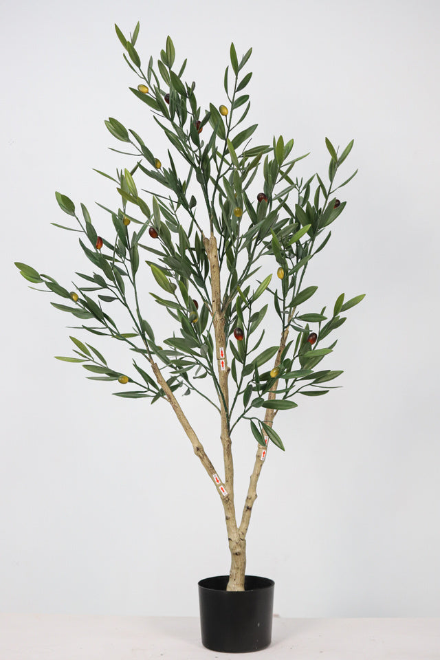 Realistic faux olive tree styled for a warm living room interior